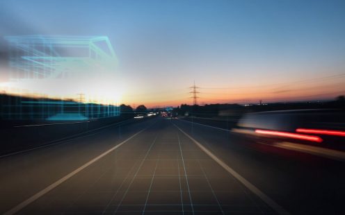 A road at night in motion with blurred lights | Pipelife